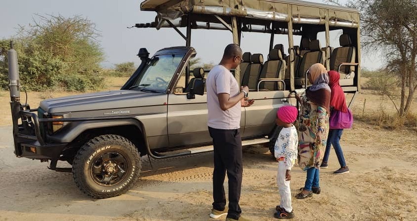 A safari truck taking tourists at Murchison falls national park