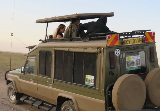 Luxury safari land cruiser on a cross-border primate trekking tour from Kigali to Murchison Falls Uganda.