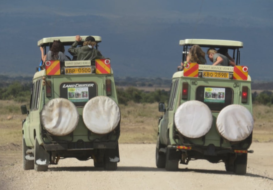 Two Angara tours hardline Landcruiser on game drive in Ishasha