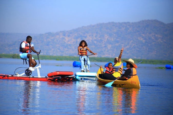 Tourists on a water for sunset cycling adventure